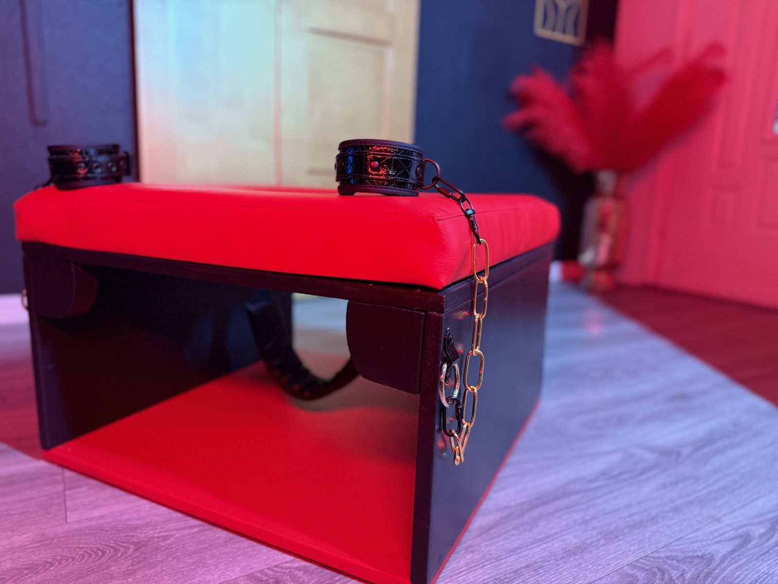 The Red Chamber king suite bathed in red mood lighting